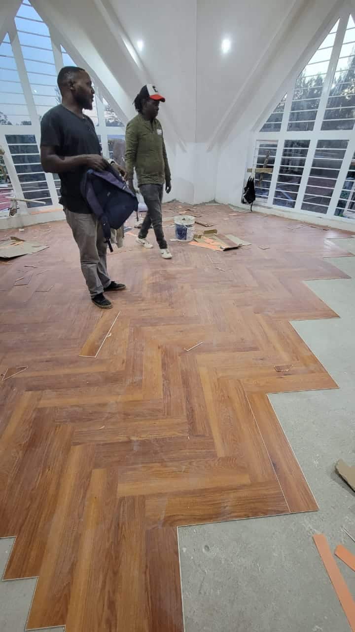 SPC flooring planks with a natural wood grain texture laid in a Kenyan home interior as one of the flooring options in kenya
