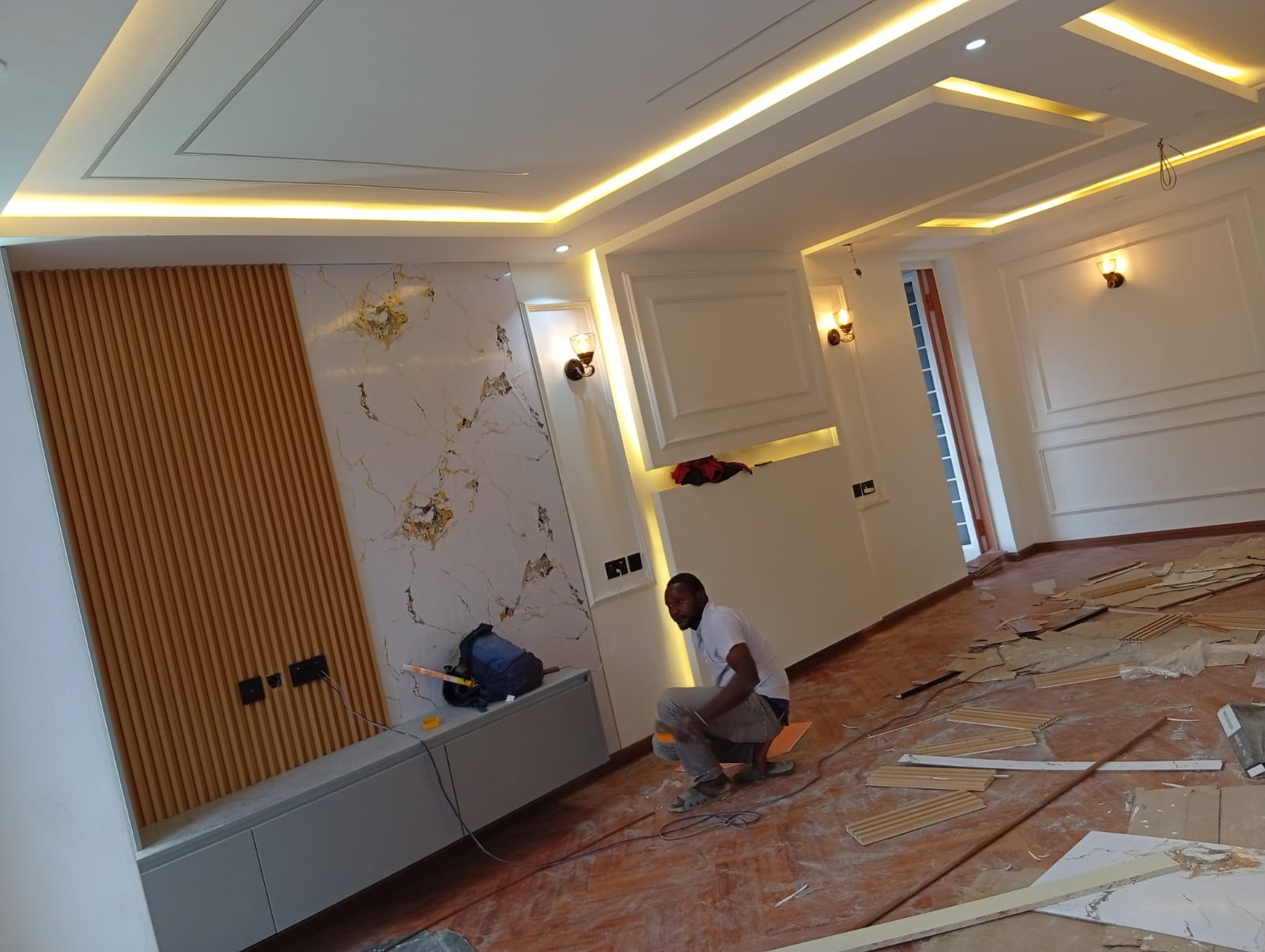 Best interior designers in Nairobi delivering a completed modern home interior with gypsum ceiling, SPC flooring, feature wall and pendant lighting in a Nairobi residence