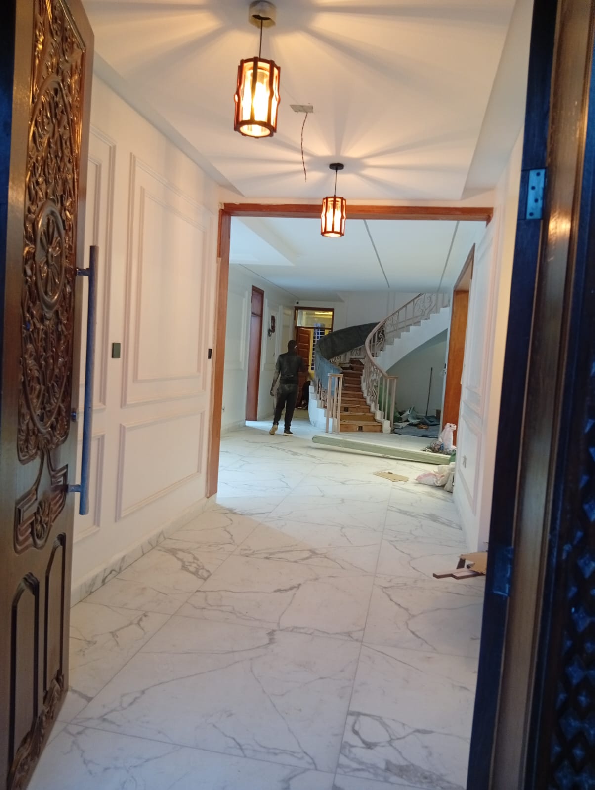 Interior designer portfolio showing completed Nairobi home projects with gypsum ceilings, feature walls, SPC flooring and custom furniture