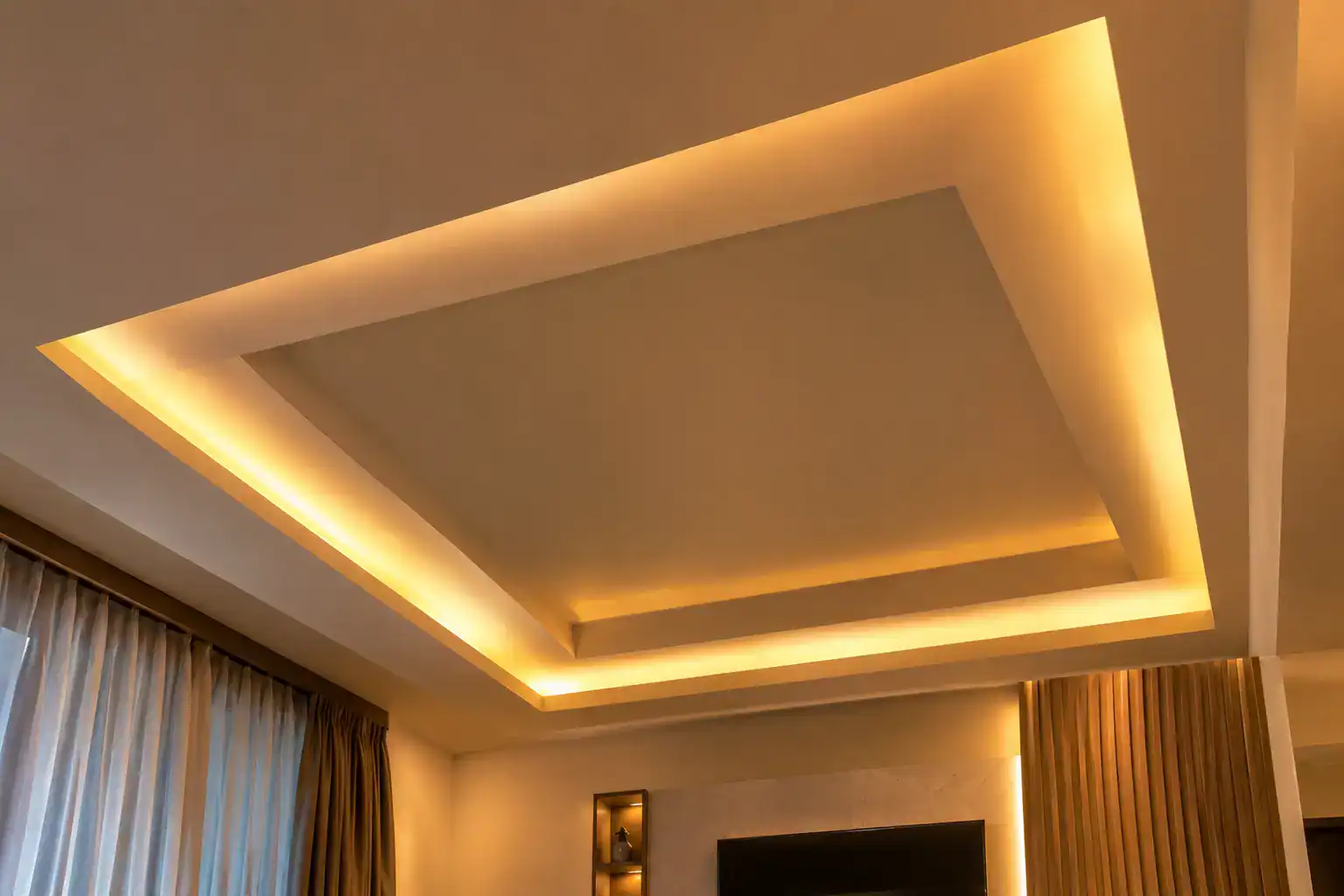 Gypsum ceiling with integrated cove lighting in a Kenyan home, an example of ambient lighting design